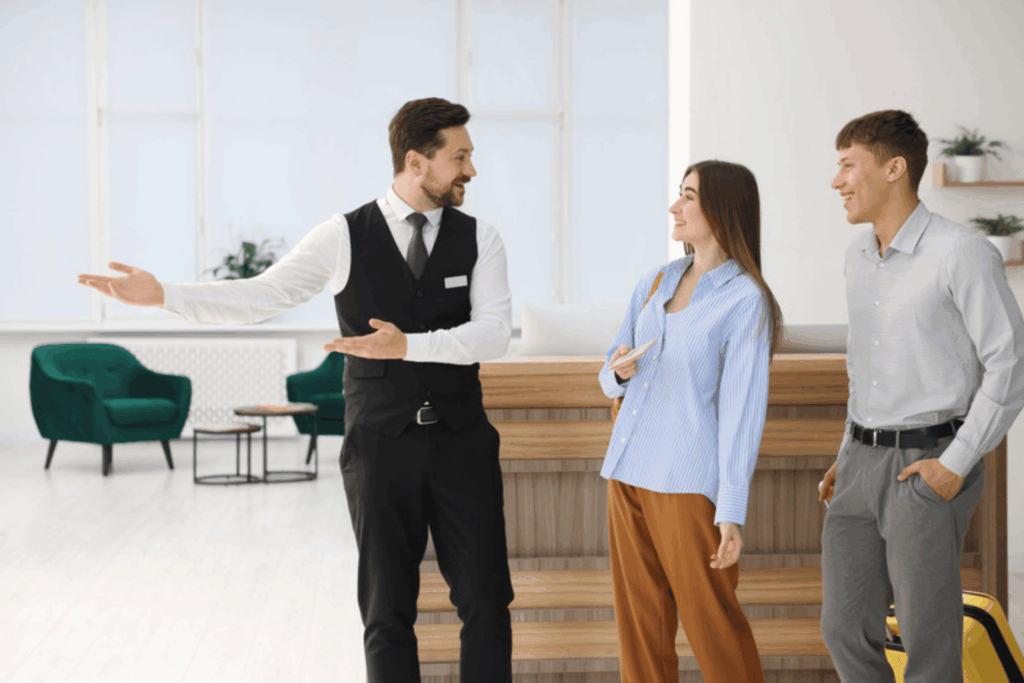 Hotel staff member welcoming guests in the lobby